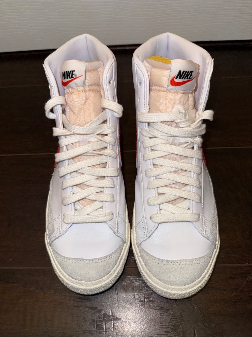 Nike Women’s White and Pink High-Top Sneakers with Red Swoosh
